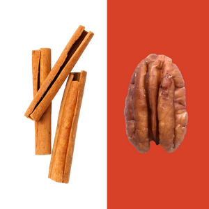 A stick of cinnamon and a single pecan.